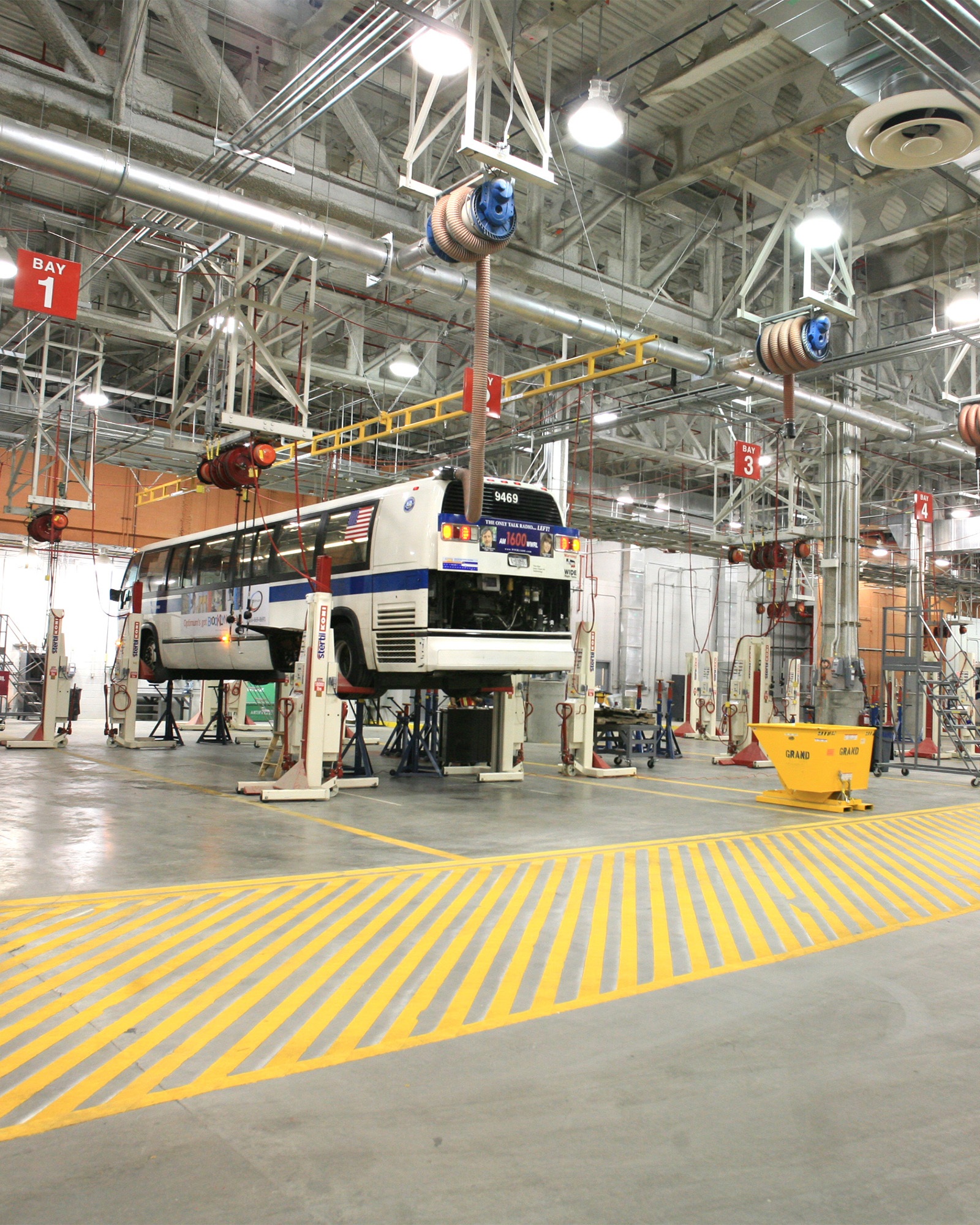 MTA bus being lifted for maintenance