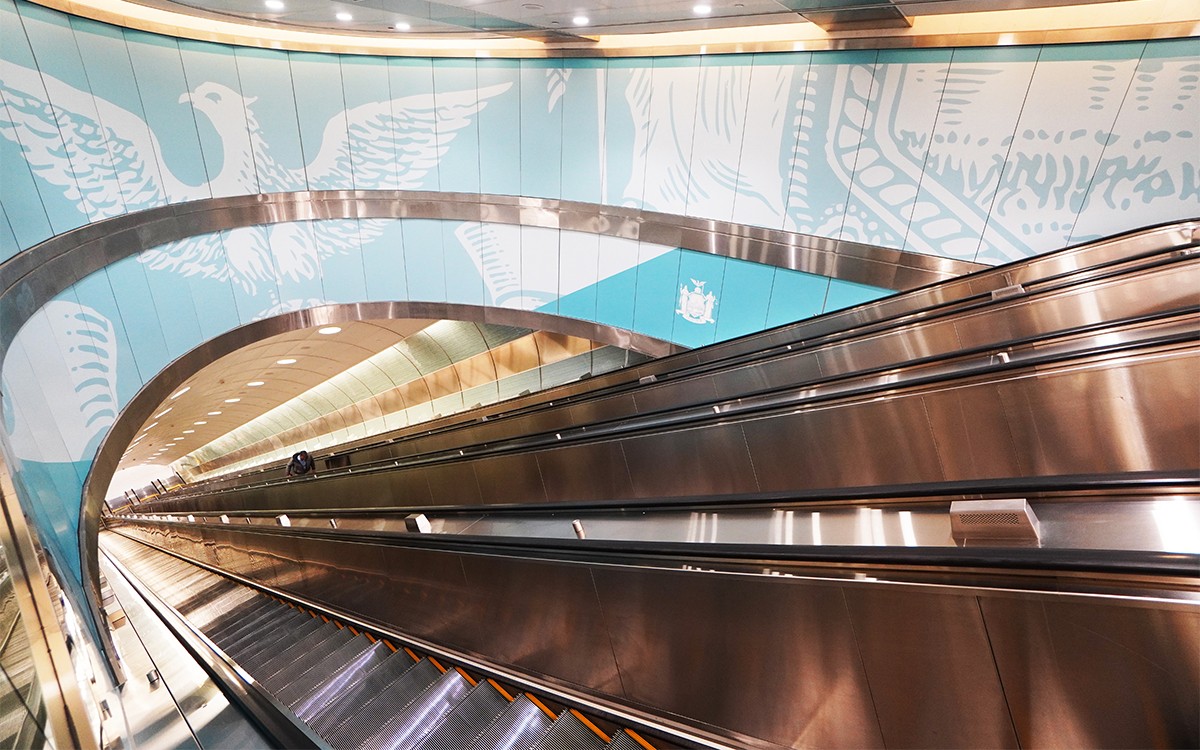 station escalator with graphics