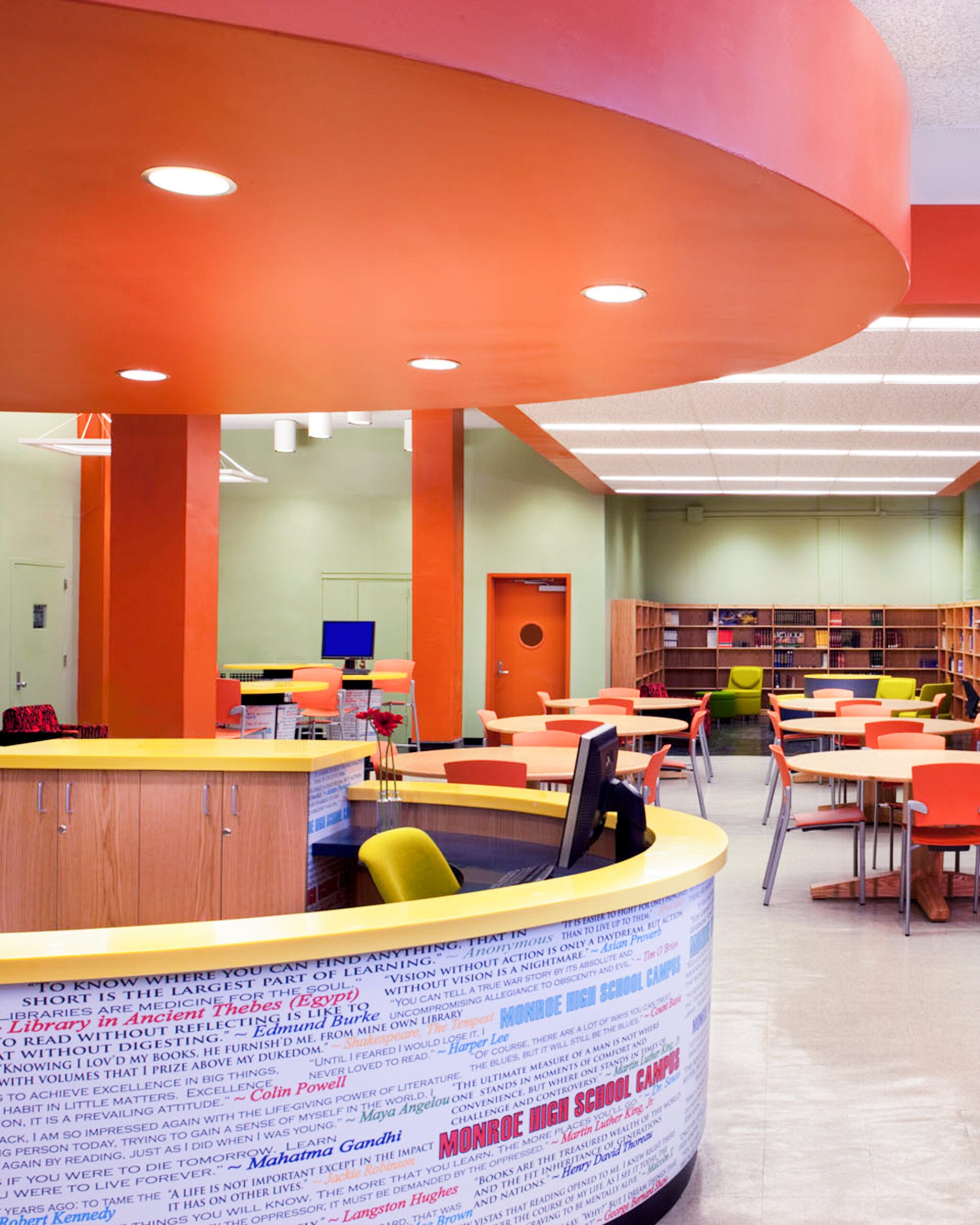 New Visions Public Libraries front desk and worktables